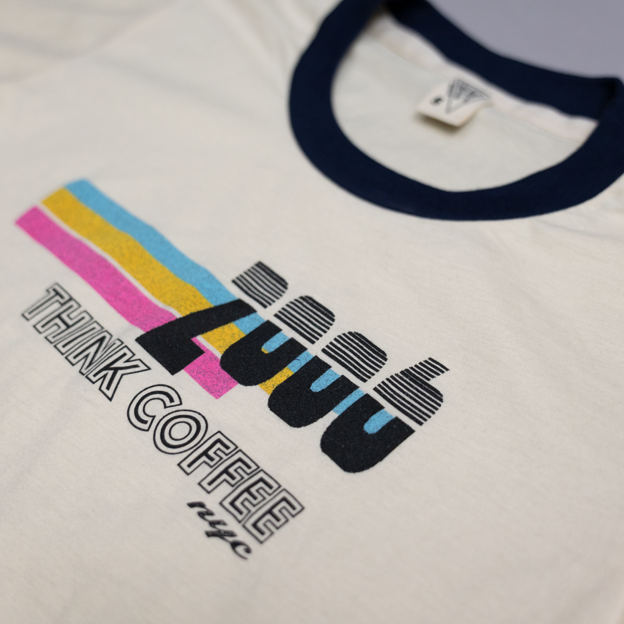 T-shirt with colorful text design on a white background