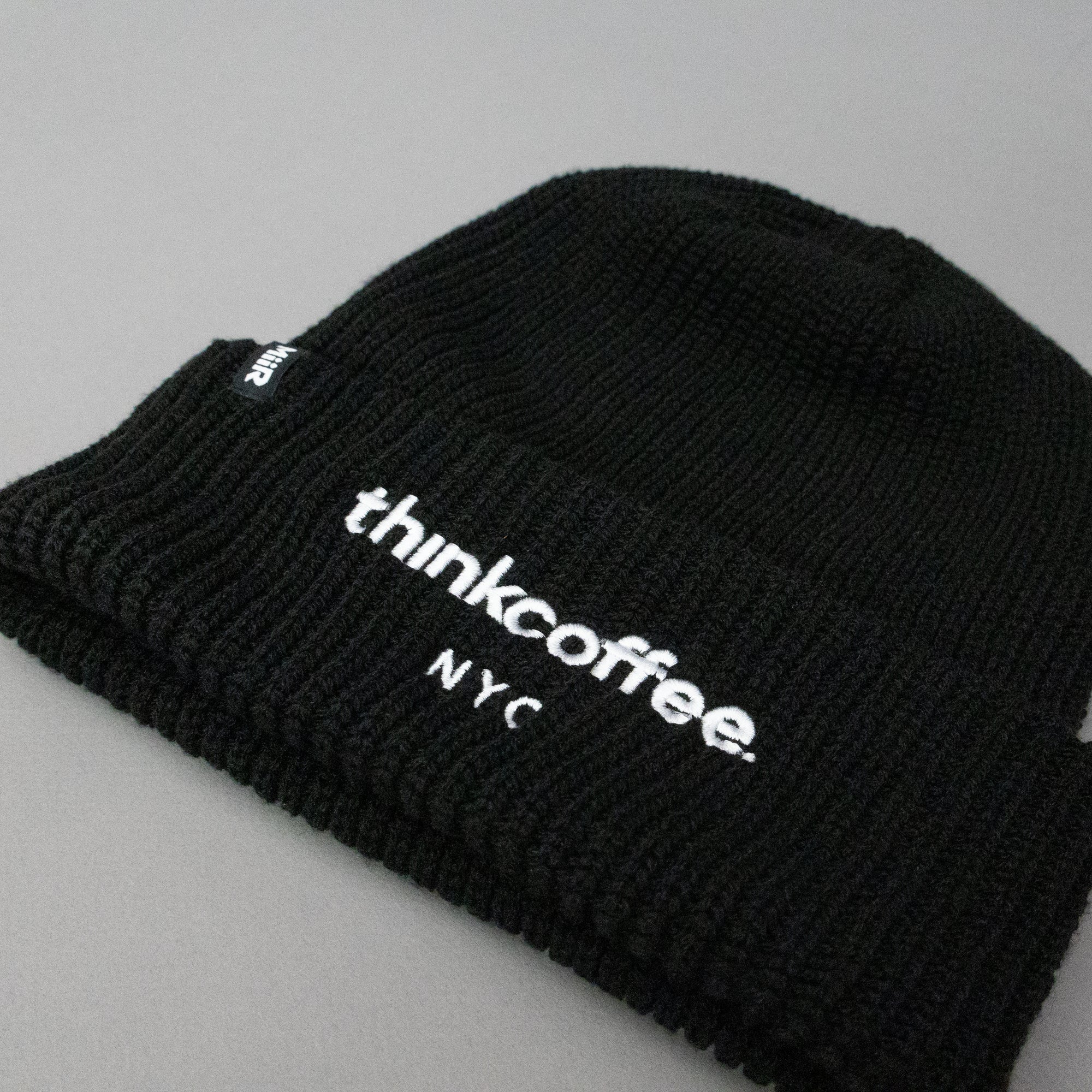 Black beanie with 'thinkcoffee NYC' text 